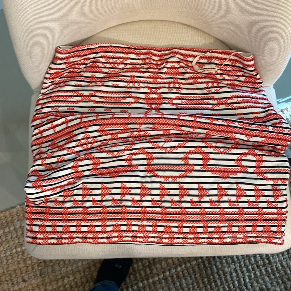 Really cute white with black stripes mini skirt with stitched red X’s
